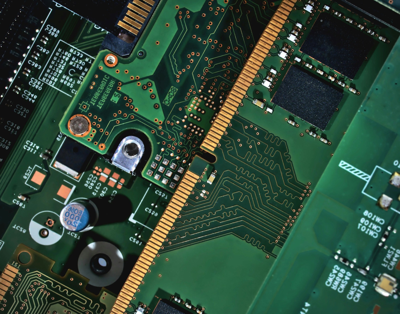 Green circuit board macro showing memory slots and component lanes for Epo-Weld™ HTE high-temperature epoxy electronic