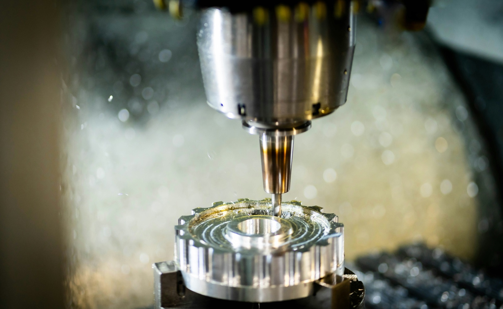 CNC milling machine precision machining an aluminum gear component for Uni-Weld™ UV adhesive metal-to-plastic